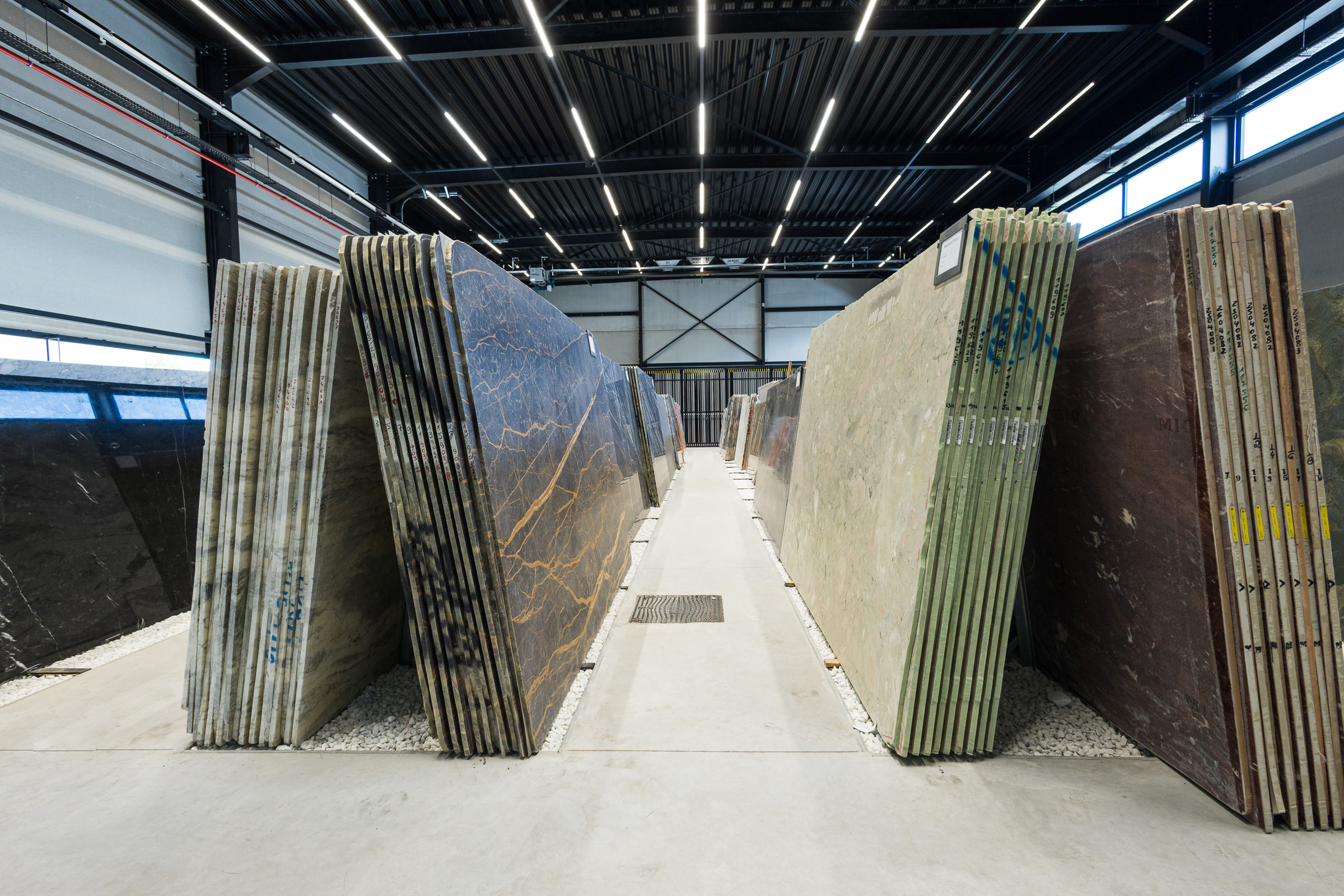 Stone slab warehouse aisle — Interior Photography, Brussels